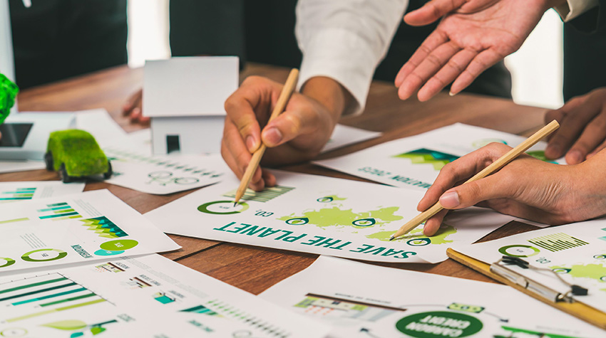 Eco business company meeting with group of business people planning strategy and discuss marketing of eco-friendly and renewable clean energy products. Green business company concept. Trailblazing